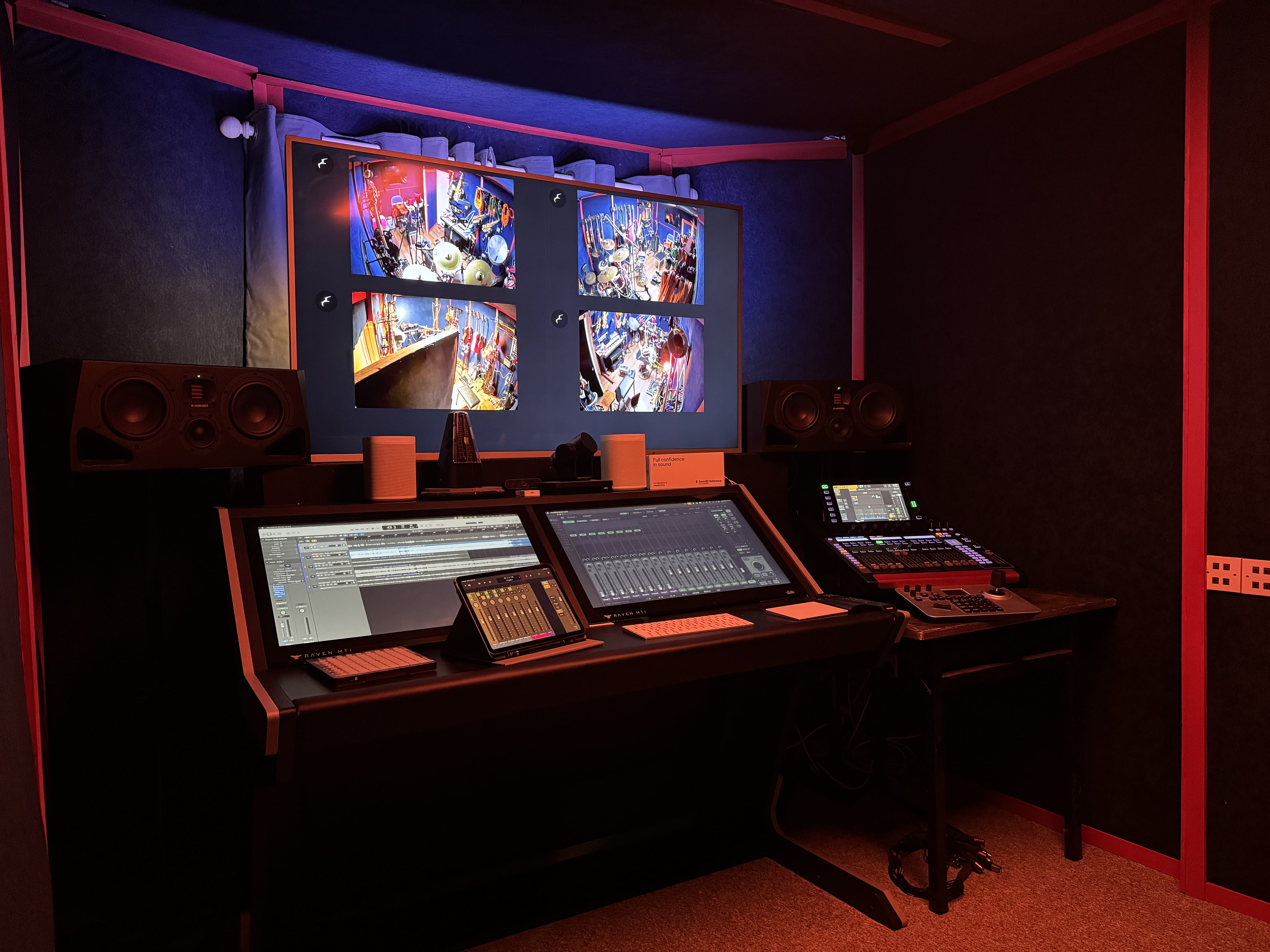The mixing desk at 4chordsStudios under warm studio lighting